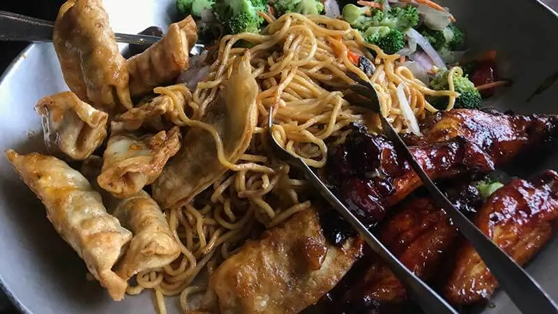 Ohana Appetizer comes out with Chicken Wings, Pork Dumplings, Noodles and Veggies.