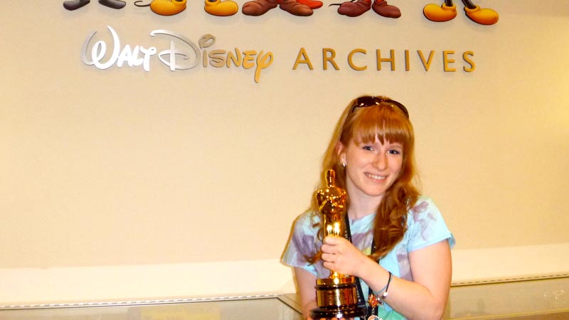 Adventures by Disney holding an Oscar Walt Disney Archives